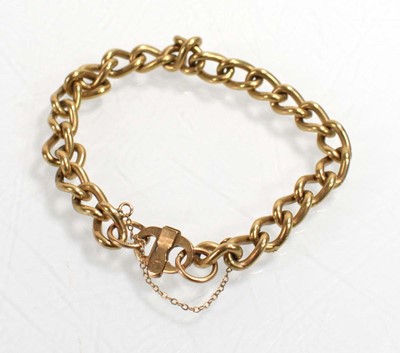 Lot 551 - A 9ct yellow gold curblink bracelet with pigs...