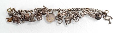 Lot 556 - A silver curblink bracelet suspending a...