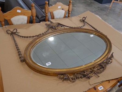Lot 1224 - Ornate gilt framed oval mirror with ribbon and...