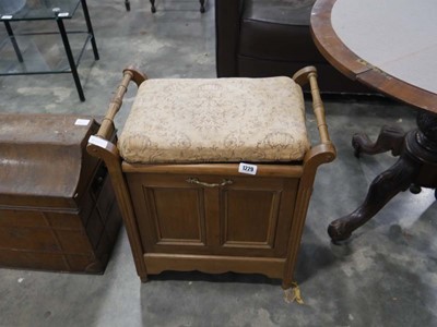 Lot 1229 - Upholstered piano stool with storage seat