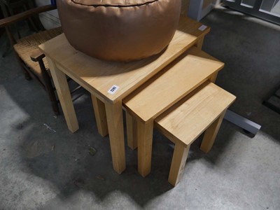 Lot 1241 - Nest of 3 light wood tables