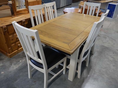 Lot 1259 - Oak extending cream base dining table with set...