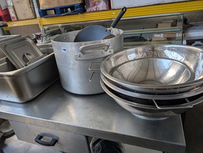Lot 146 - Stack of stainless steel colanders and 2 large...
