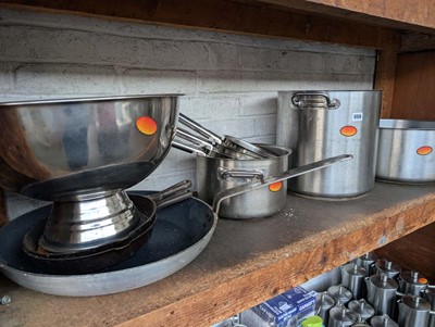 Lot 558 - Shelf of stainless steel aluminium cookware,...