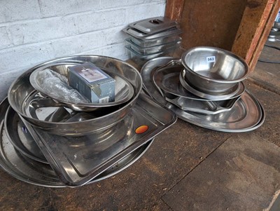 Lot 563 - Half a shelf containing stainless items, to...