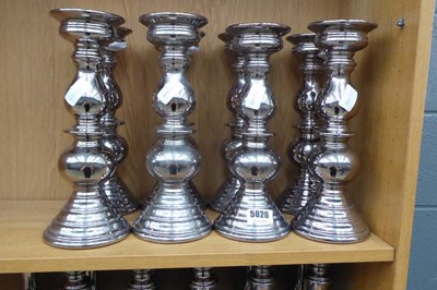 Lot 5026 - 8 silver painted candlesticks