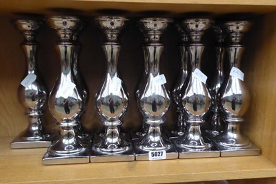 Lot 5027 - 11 silver painted candlesticks