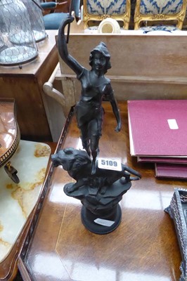 Lot 5109 - A Spelter figure lady and lion