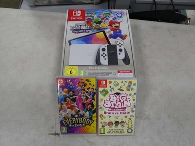 Lot 2175 - Boxed Nintendo Switch OLED with 2 games - Big...