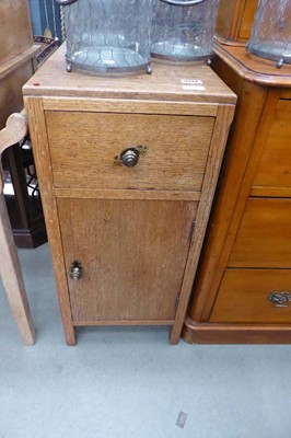 Lot 5134 - An Oak single door pot cupboard with drawer over