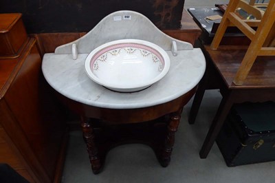 Lot 5137 - A Demi-lune marble topped washstand with a...