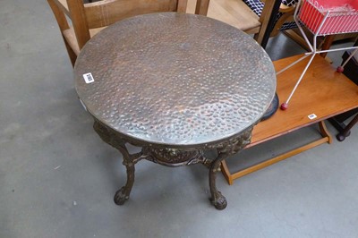 Lot 5165 - A cast iron garden table with beaten copper...