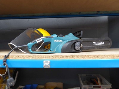 Lot 4509 - Makita electric chainsaw with face shield and...