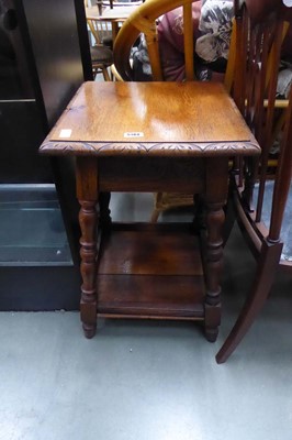 Lot 5184 - An oak two-tier lamp table