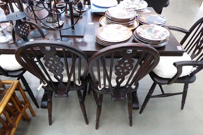 Lot 5195 - A dark oak draw leafed table with 6 chairs to...