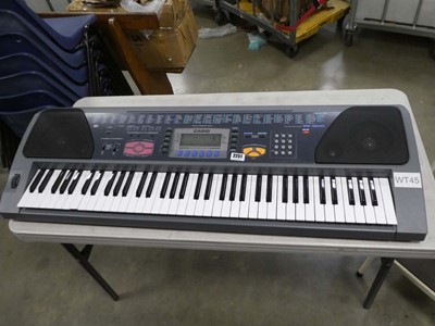 Lot 2251 - Casio WK1200 keyboard with a box containing...