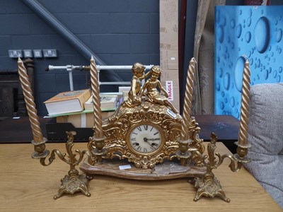 Lot 5335 - Ornate gilt mantle clock with a pair of...