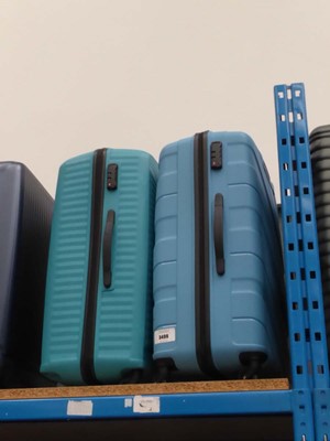 Lot 3499 - 2 large hard shelled American Tourister suitcases