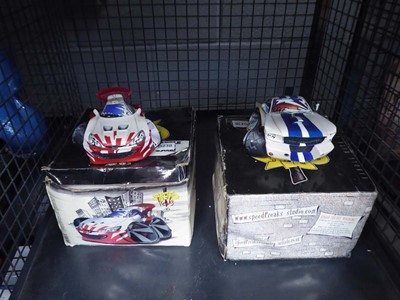 Lot 5542 - Cage containing 2 Speed Freak cars