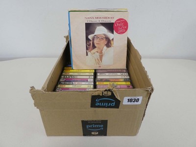 Lot Box containing music cassettes and 7" singles...