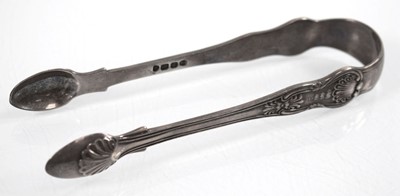 Lot 304 - A pair of Regency silver sugar tongs, London...