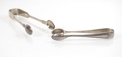 Lot 306 - Two pairs of silver sugar tongs, London 1890...