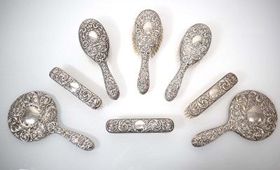 Lot 318 - A harlequin silver-mounted dressing table set...