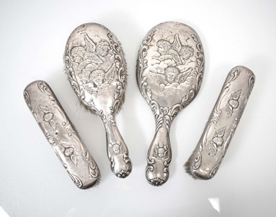 Lot 319 - An Edwardian silver-mounted dressing table set...