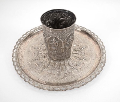 Lot 326 - An Indian white metal beaker relief decorated...
