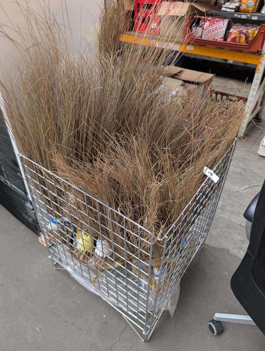 Lot 972 - Display rack containing straw grass brushes