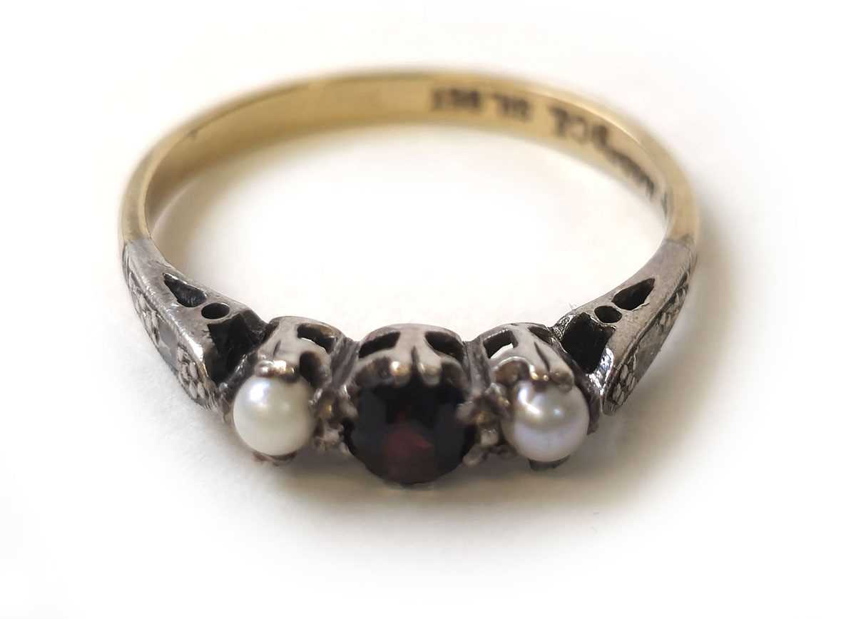 Lot 406 - A mid 20th century garnet and pearl ring...