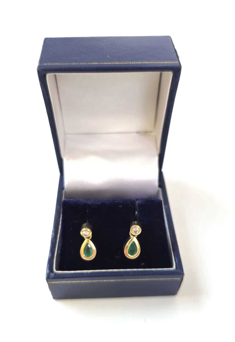 Lot 415 - A pair of yellow metal, emerald and diamond...