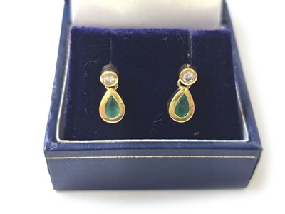 Lot 415 - A pair of yellow metal, emerald and diamond...