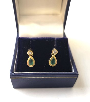 Lot 415 - A pair of yellow metal, emerald and diamond...