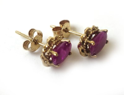 Lot 423 - A pair of 9ct gold and ruby stud earrings