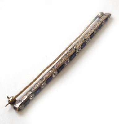 Lot 424 - An early 20th century yellow metal, blue and...