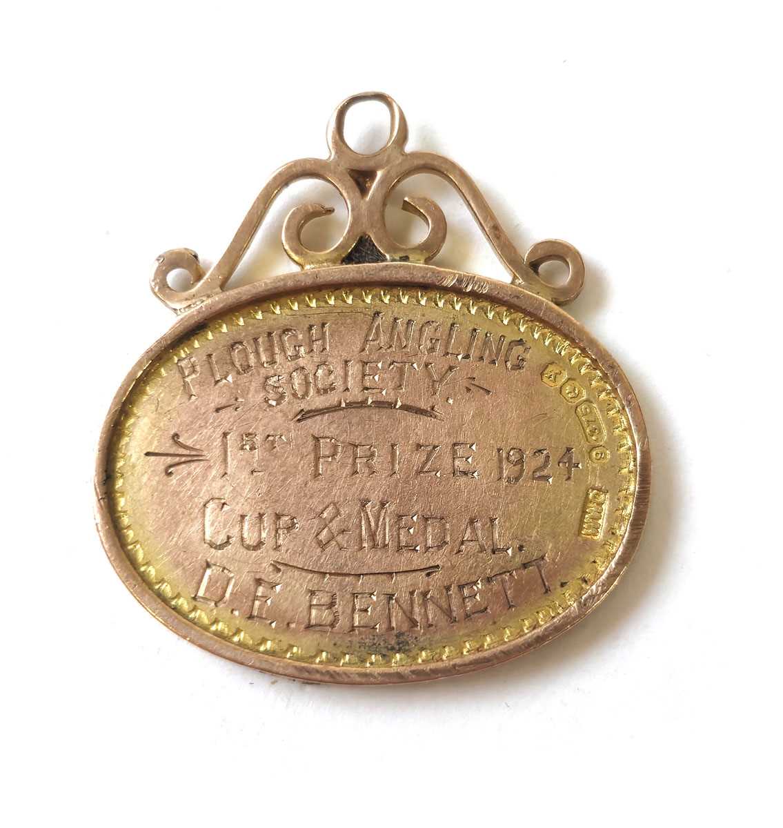 Lot 428 - A 9ct gold fob 'Plough Angling Society 1st...