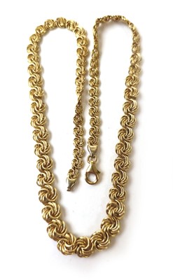 Lot 433 - An 18ct gold chain with swirl design. Approx....