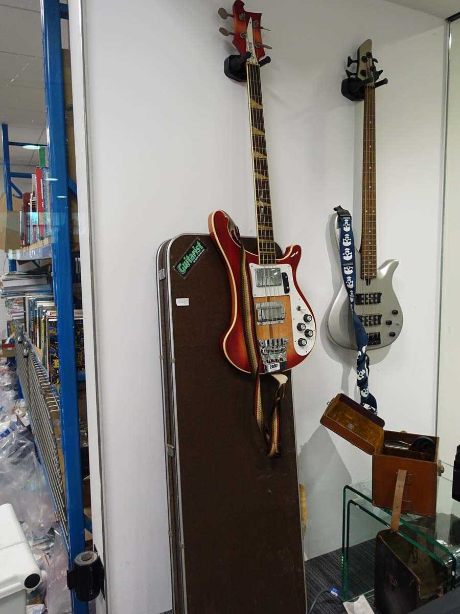 Lot 2097 - 4 string Ibanez bass guitar with case, in red...