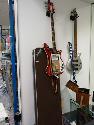 Lot 2097 - 4 string Ibanez bass guitar with case, in red...