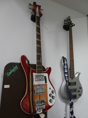 Lot 2097 - 4 string Ibanez bass guitar with case, in red...