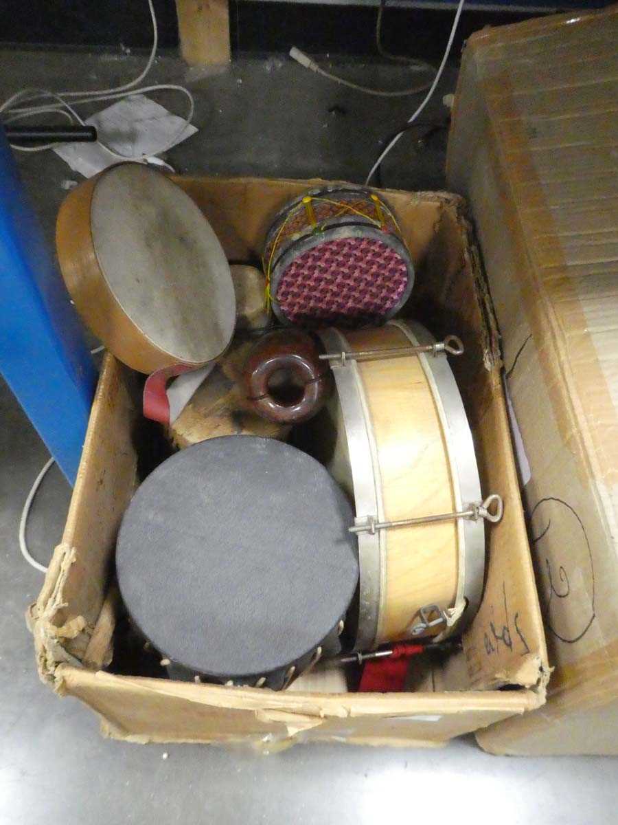 Lot 2297 - Box containing various percussion instruments...