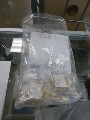 Lot 2391 - Bag containing decorative machine pressed and...