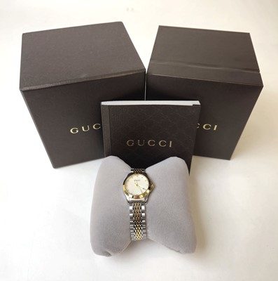 Lot 452 - A ladies Gucci G-Timeless wristwatch together...