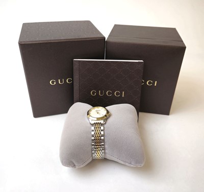Lot 452 - A ladies Gucci G-Timeless wristwatch together...