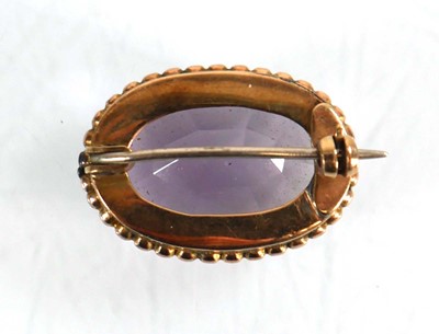 Lot 558 - A yellow metal brooch set oval amethyst...