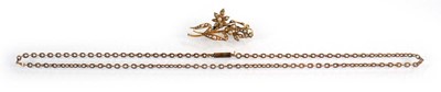 Lot 561 - A 15ct yellow gold brooch set seed pearls in a...