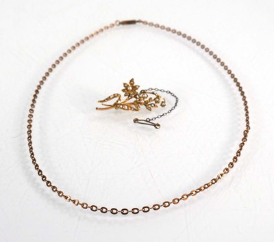 Lot 561 - A 15ct yellow gold brooch set seed pearls in a...