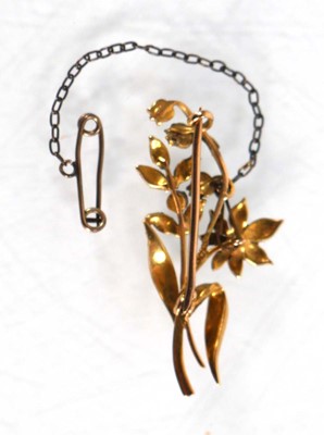 Lot 561 - A 15ct yellow gold brooch set seed pearls in a...