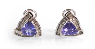 Lot 563 - A pair of 14ct white gold ear studs, each set...
